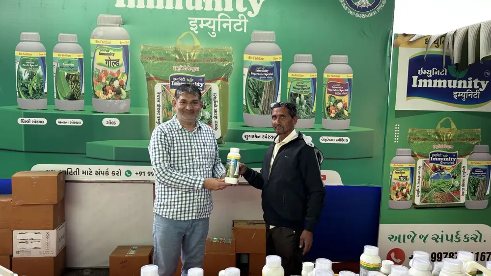 Agri input shop counter with Immunity bottles on display and the shop owner